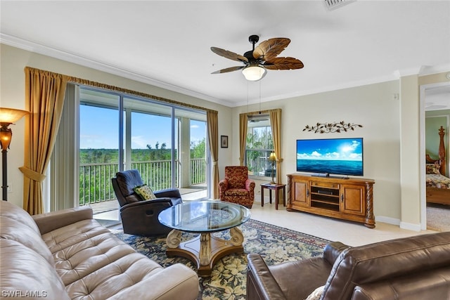 tiled living room featuring plenty of natural light, crown molding, and ceiling fan