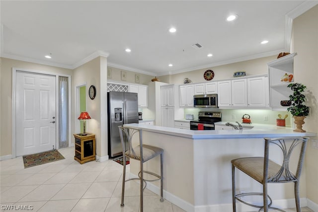 kitchen with kitchen peninsula, light tile flooring, a breakfast bar, stainless steel appliances, and white cabinets