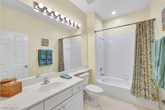 full bathroom with toilet, tile floors, shower / bathtub combination with curtain, and vanity with extensive cabinet space