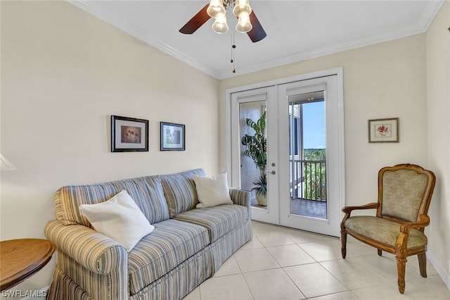 tiled living room featuring ornamental molding, ceiling fan, and french doors