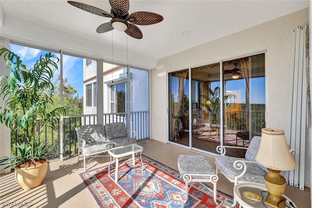 sunroom featuring ceiling fan