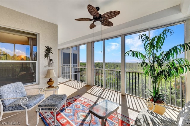 sunroom with plenty of natural light and ceiling fan