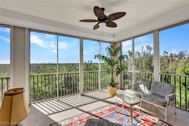 sunroom / solarium featuring ceiling fan