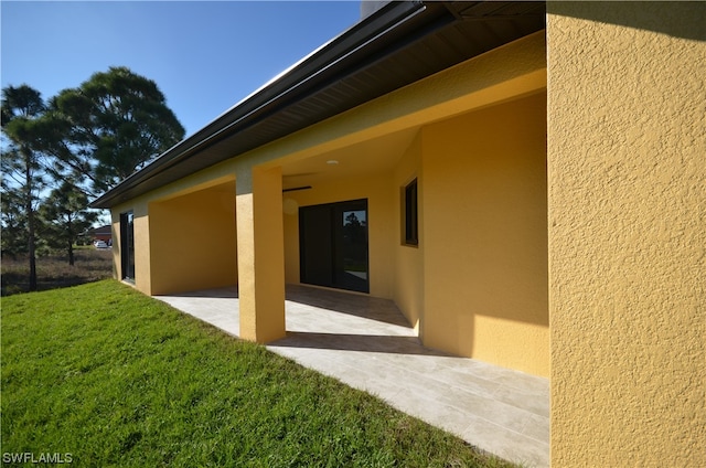 exterior space featuring a patio area and a yard