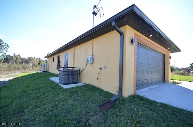 view of side of home with a yard