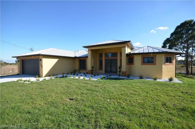 view of front facade with a front yard and a garage