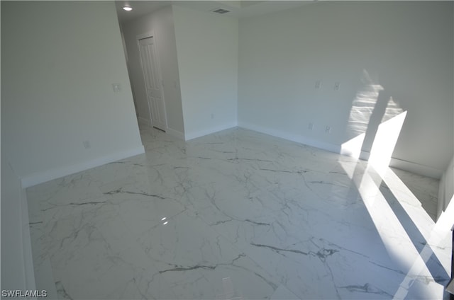 empty room with light tile floors