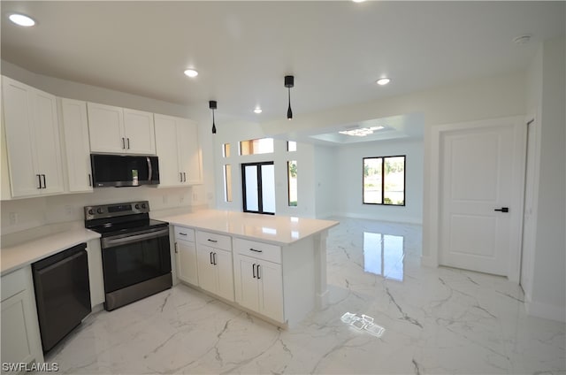 kitchen with hanging light fixtures, light tile flooring, white cabinetry, and stainless steel appliances