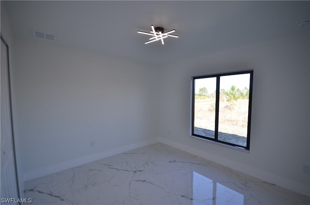 unfurnished room with ceiling fan