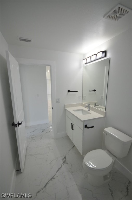 bathroom with vanity, tile flooring, and toilet