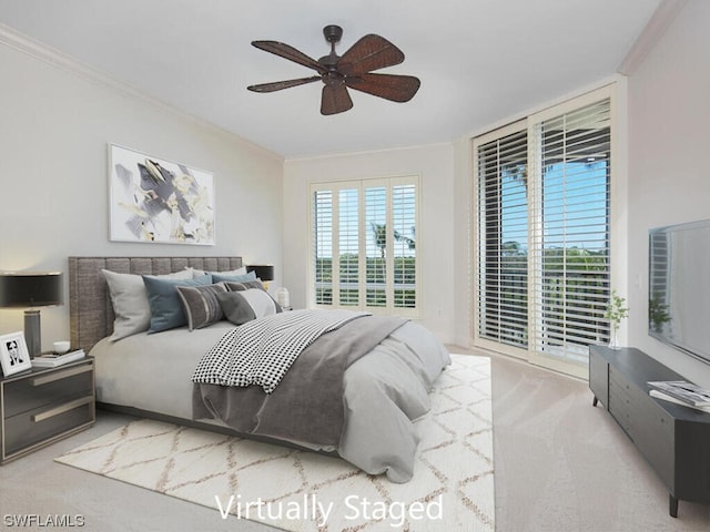 bedroom featuring light carpet, ornamental molding, and ceiling fan