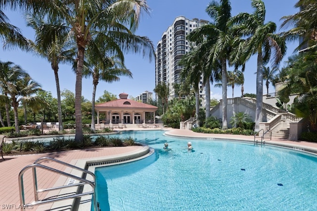 pool featuring a patio and stairs