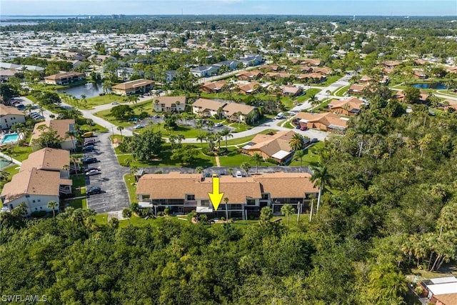 birds eye view of property with a residential view