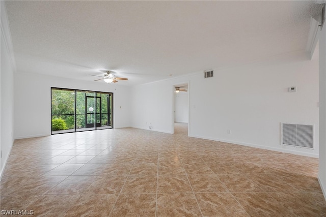 unfurnished room with ornamental molding, a textured ceiling, ceiling fan, and light tile patterned flooring