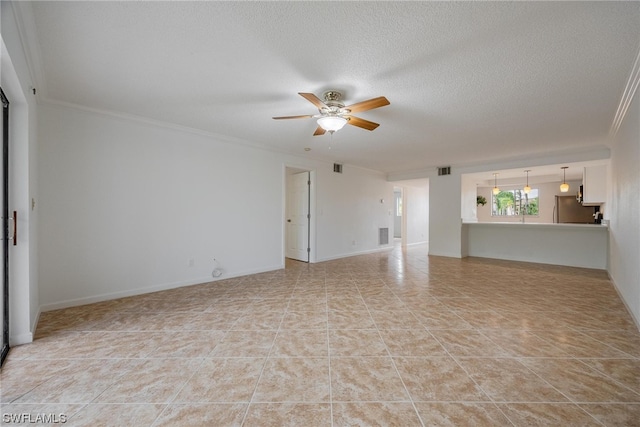 tiled empty room with ornamental molding, a textured ceiling, and ceiling fan