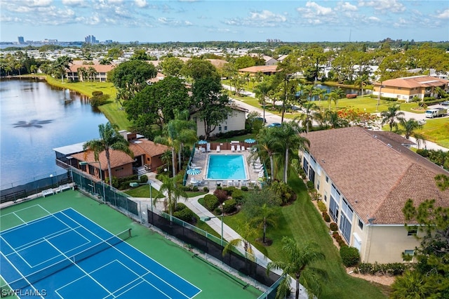 birds eye view of property with a water view