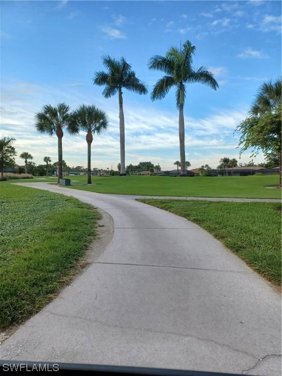 view of home's community with a lawn