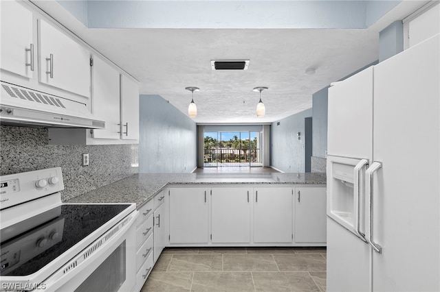 kitchen with electric range oven, exhaust hood, white refrigerator with ice dispenser, white cabinets, and hanging light fixtures