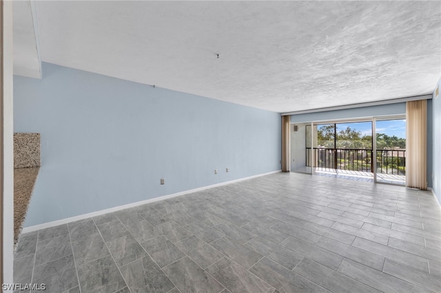 empty room with a textured ceiling