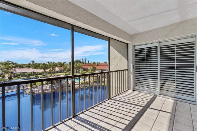 balcony featuring a water view