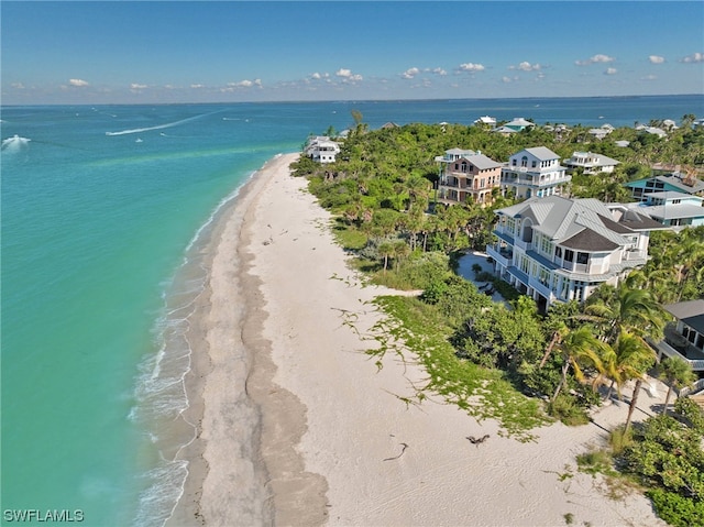 drone / aerial view with a view of the beach and a water view