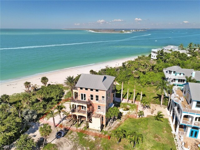 drone / aerial view with a view of the beach and a water view