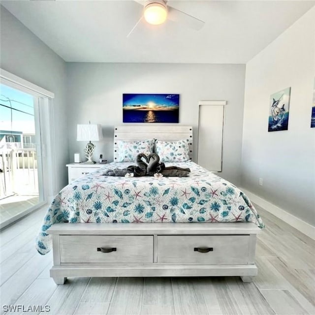 bedroom with ceiling fan and baseboards