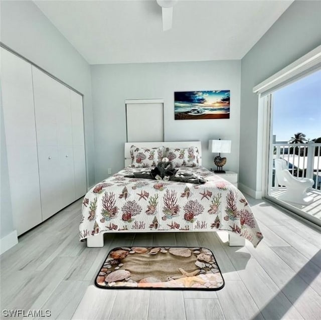 bedroom featuring ceiling fan, a closet, baseboards, and access to exterior