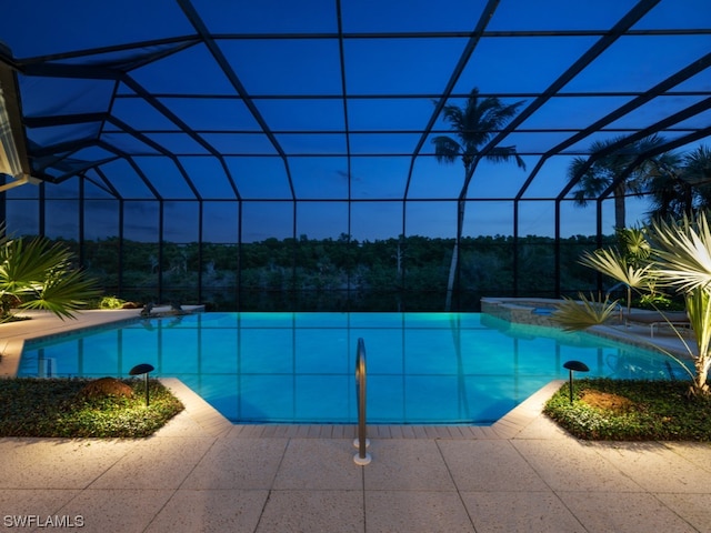 view of pool featuring a lanai and a patio