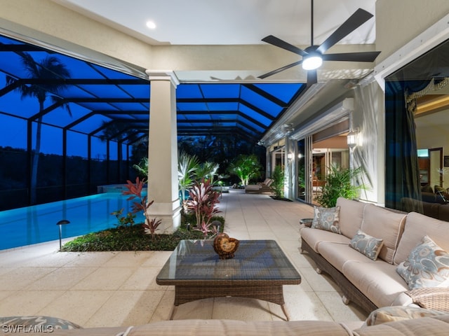 view of patio / terrace with glass enclosure, ceiling fan, and an outdoor living space