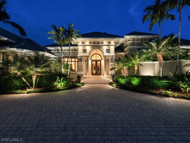 mediterranean / spanish-style home featuring french doors