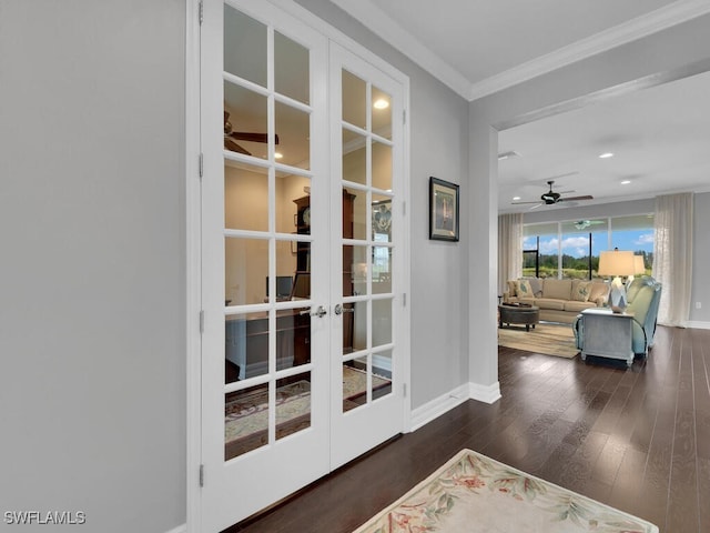 doorway featuring french doors, ceiling fan, ornamental molding, and dark wood-type flooring