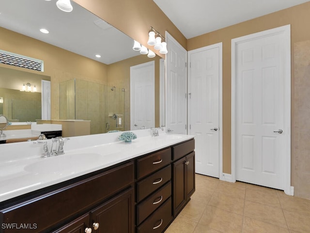 bathroom featuring vanity, tile patterned flooring, and a shower with door