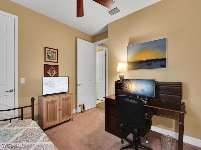 office space featuring ceiling fan and light colored carpet