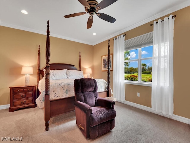 carpeted bedroom featuring ceiling fan and ornamental molding