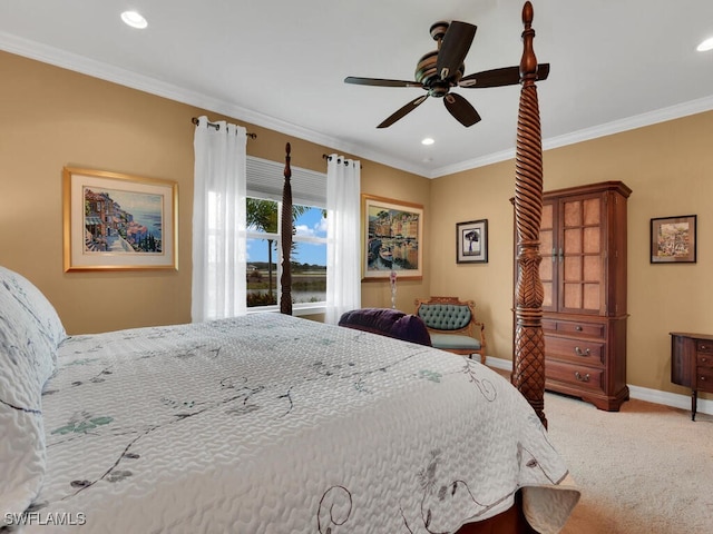 carpeted bedroom with ornamental molding and ceiling fan