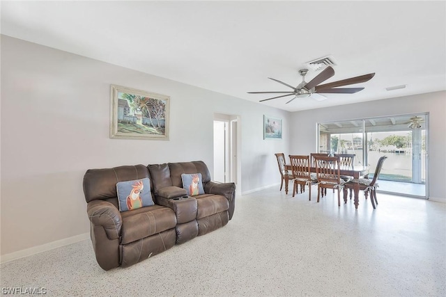 living room featuring ceiling fan