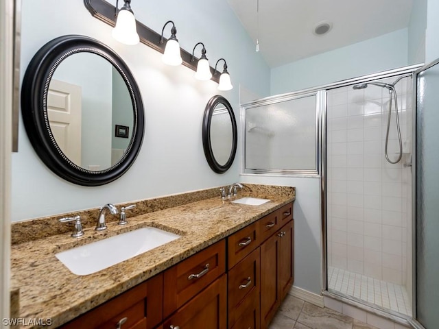 bathroom featuring walk in shower, tile patterned floors, and vanity