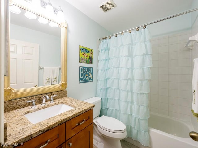 full bathroom with vanity, toilet, and shower / bath combo with shower curtain