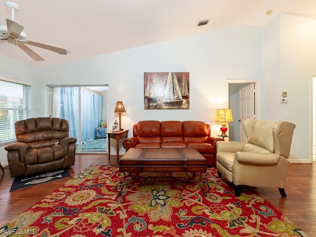 living room featuring vaulted ceiling, wood-type flooring, and ceiling fan