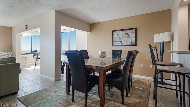 6672 Estero Blvd Unit A409, Fort Myers Beach, FL 33931 - tiled dining room with a textured ceiling