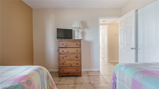 6672 Estero Blvd Unit A409, Fort Myers Beach, FL 33931 - bedroom featuring a closet and light tile patterned flooring