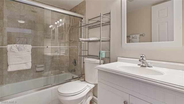 6672 Estero Blvd Unit A409, Fort Myers Beach, FL 33931 - full bathroom featuring combined bath / shower with glass door, vanity, and toilet