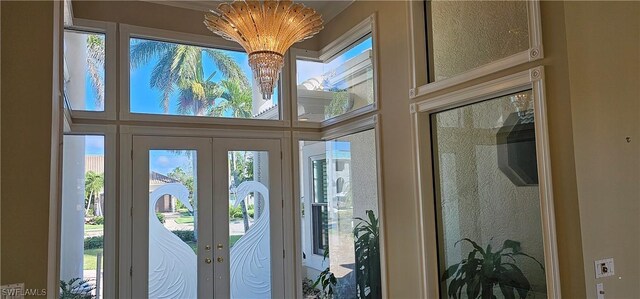 entryway with french doors and a healthy amount of sunlight