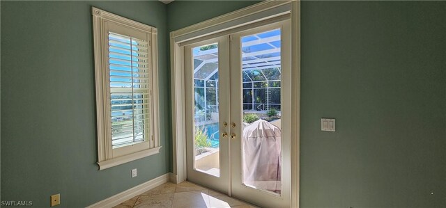 entryway featuring french doors and light tile patterned floors