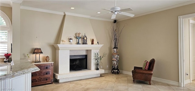 living room featuring ceiling fan, a high end fireplace, and ornamental molding