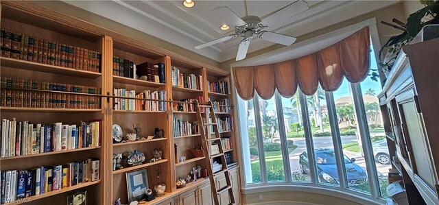 interior space with ceiling fan