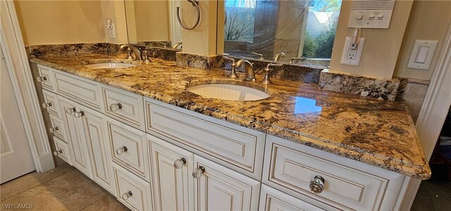 bathroom with vanity and tile patterned floors