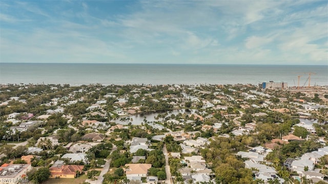 birds eye view of property with a water view and a residential view