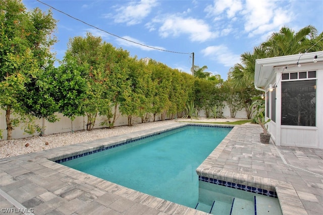 view of swimming pool featuring a fenced backyard, a fenced in pool, and a patio